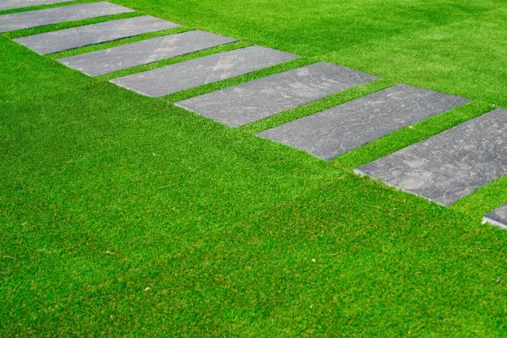 Artificial turf with pavers in between