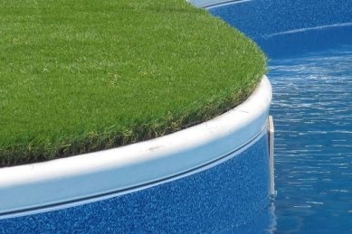 artificial grass around a swimming pool in Huntington beach CA